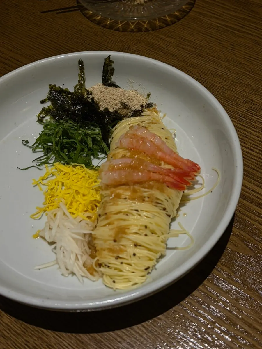 An individual side dish plate during the course