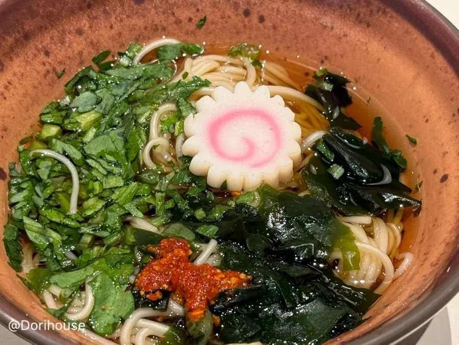 Close-up of the warm noodles with red seasoning