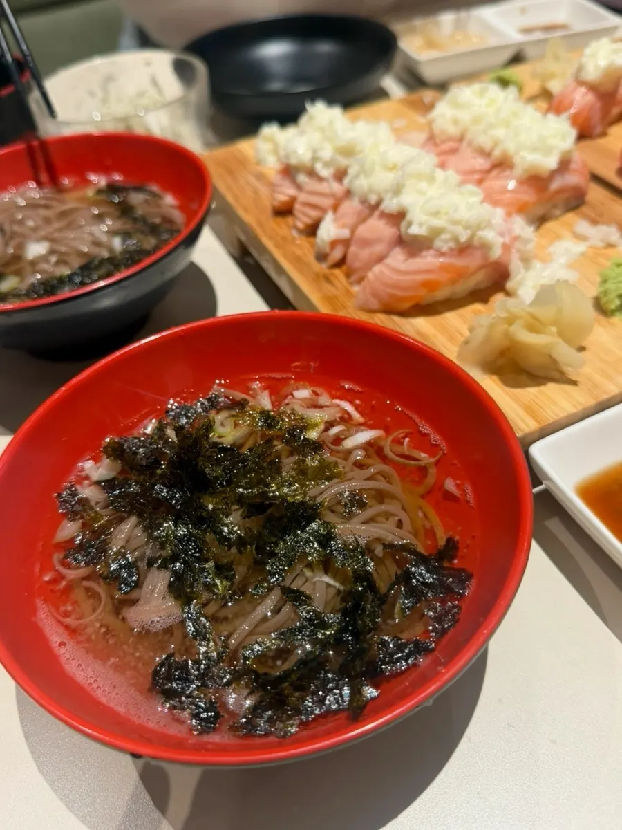 Table spread with sushi sets and shrimp tempura together