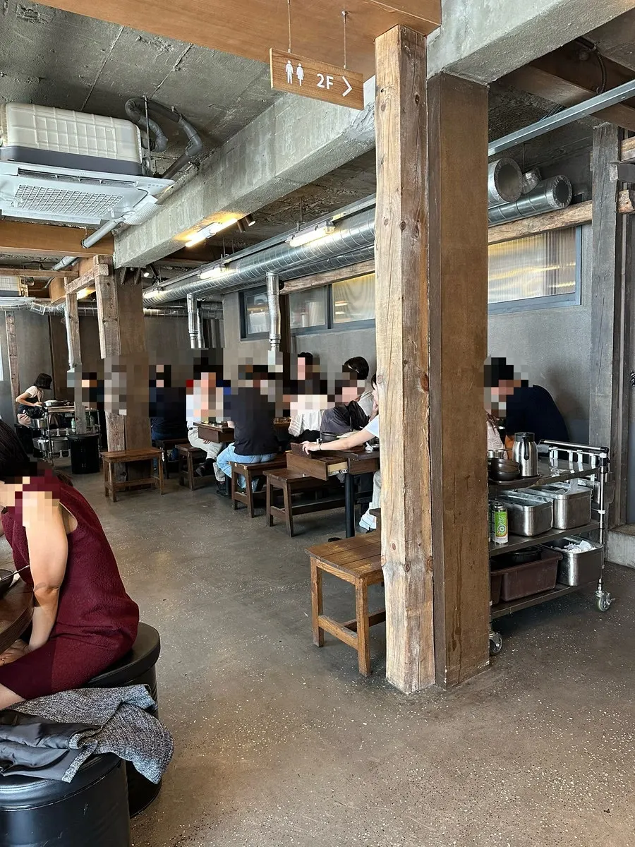 Interior of Eom Yongbaek Pork Grill Gwanghwamun Branch packed with lunchtime diners