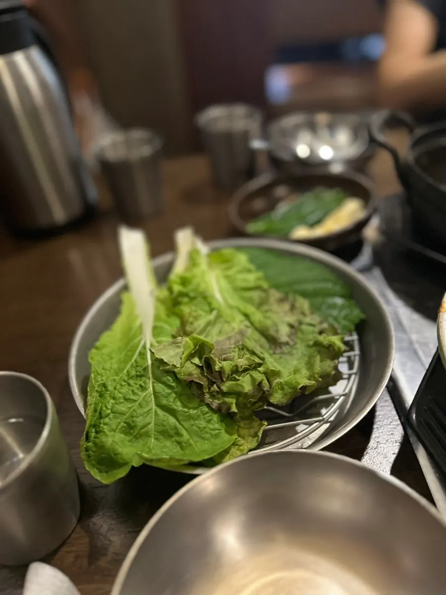 Plate of wrapping vegetables like lettuce and perilla leaves