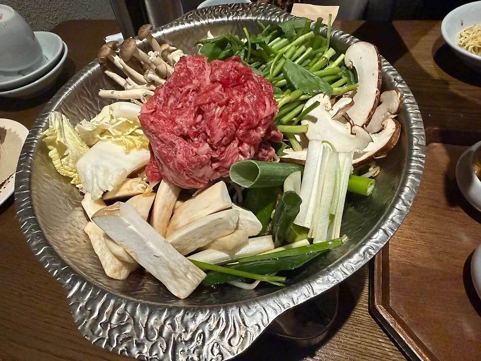 A plate of aged kimchi served before the bulgogi hot pot