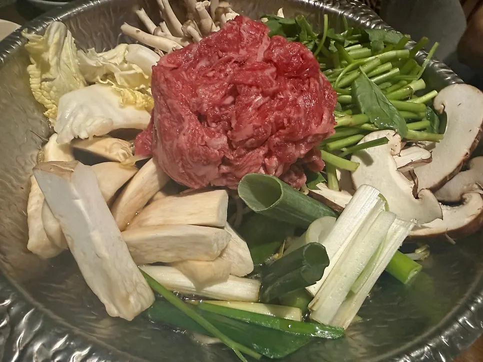 Close-up of bulgogi hot pot broth and meat