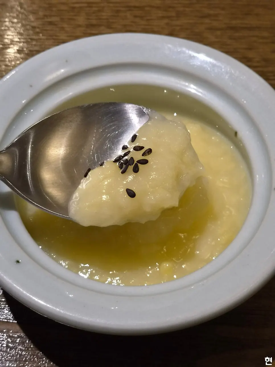 A plate of pine nut sauce mustard greens