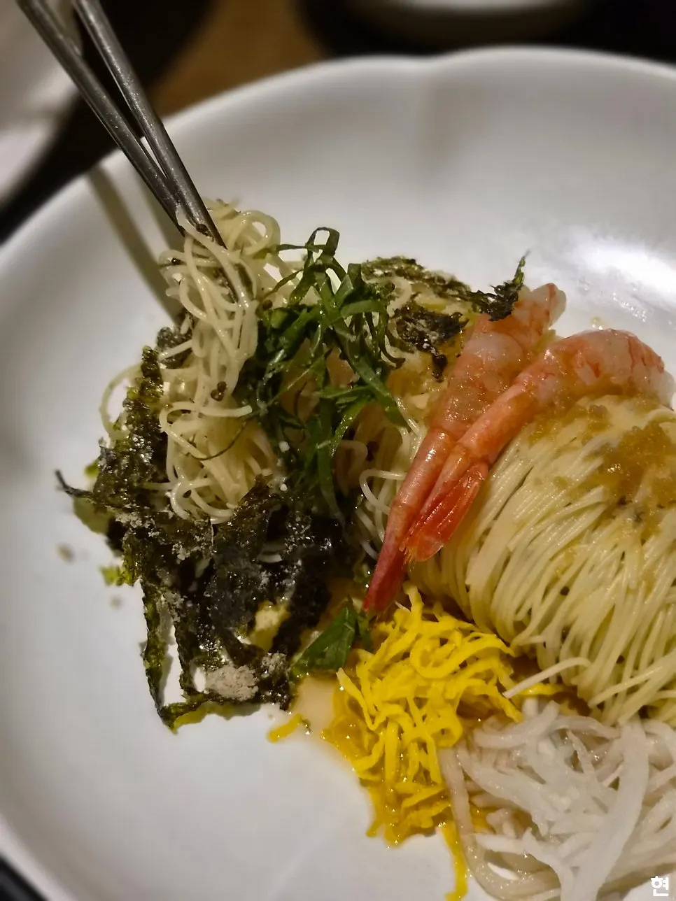 Perilla oil capellini topped with shrimp