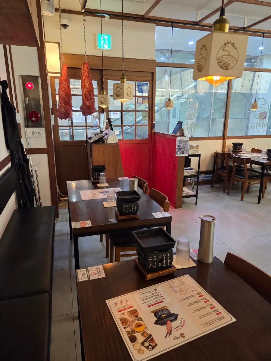 Interior of Ichigyu with four-seat tables