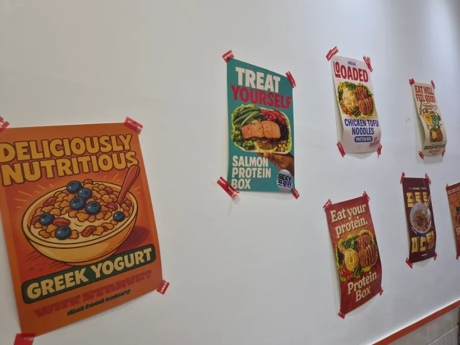 Signage noting it's Korea's first protein box restaurant