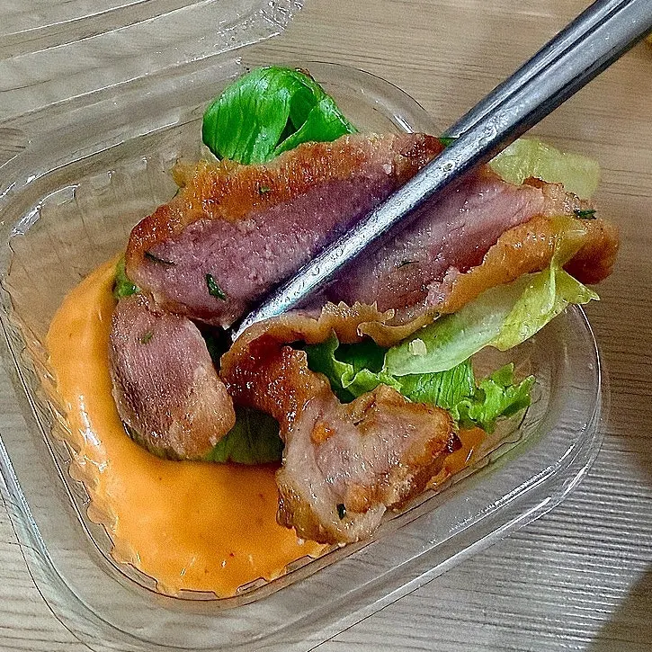 Salad drizzled with sriracha mayo sauce