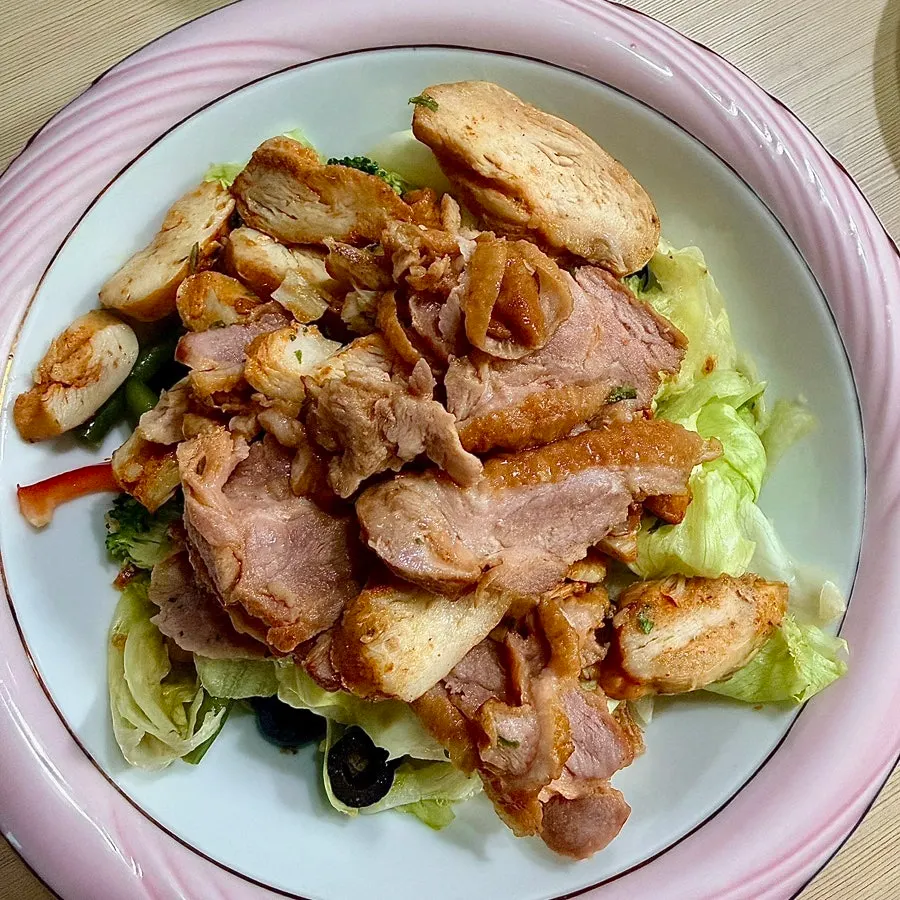 Lettuce and toppings mixed with sauce