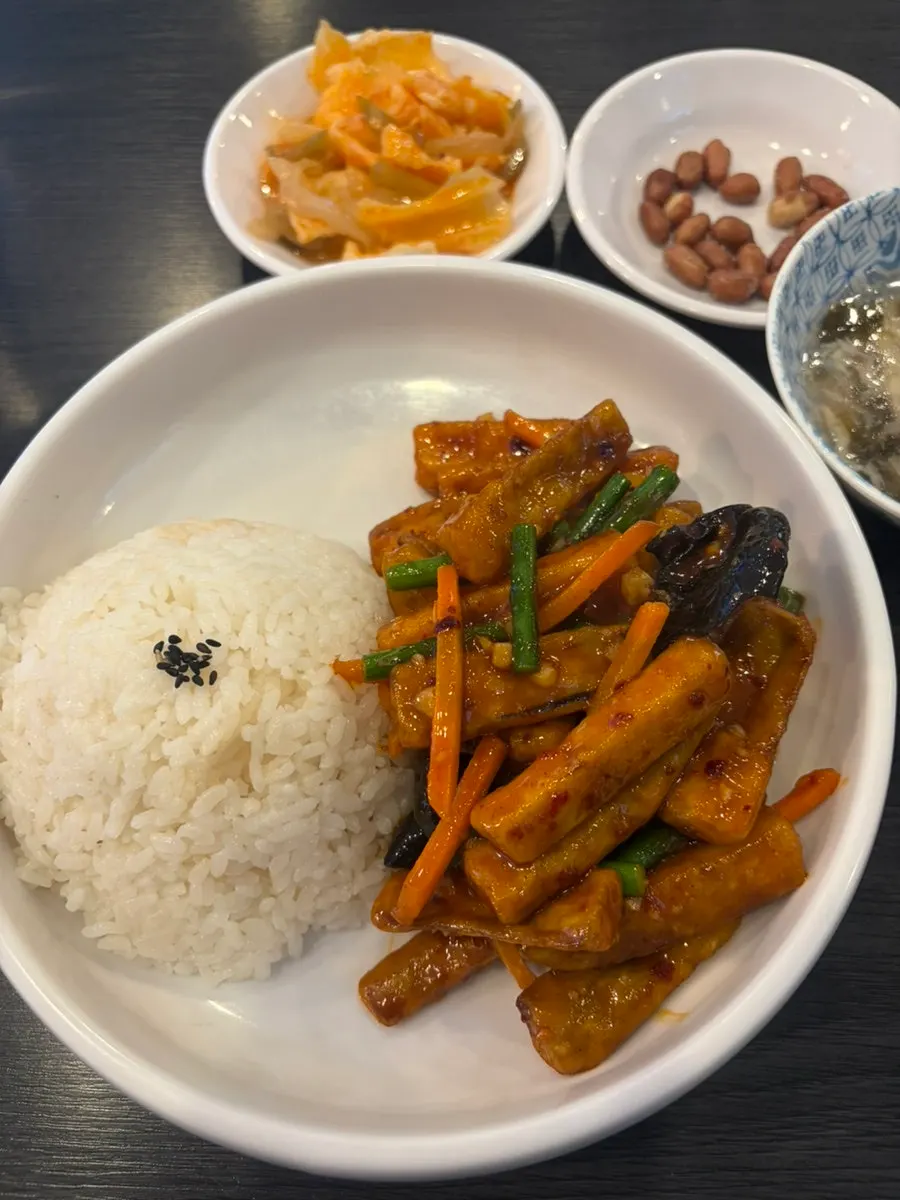 Close-up of crispy fried eggplant over rice