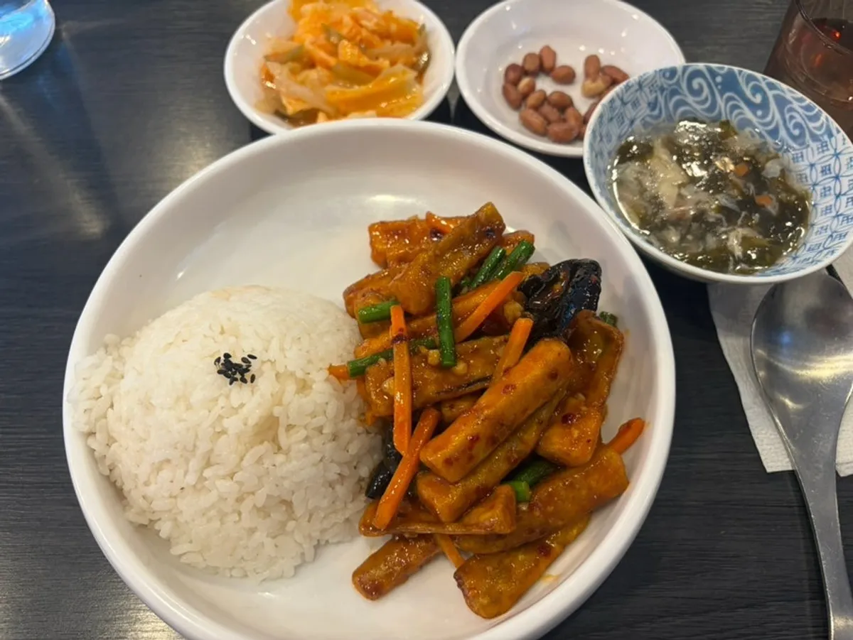 Table set with eggplant tempura rice bowl and crystal moon dumplings together
