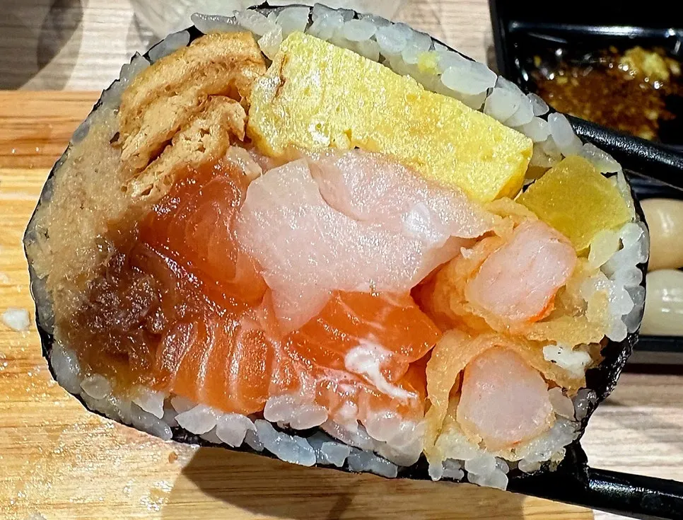 Futomaki roll filled with salmon and fried shrimp