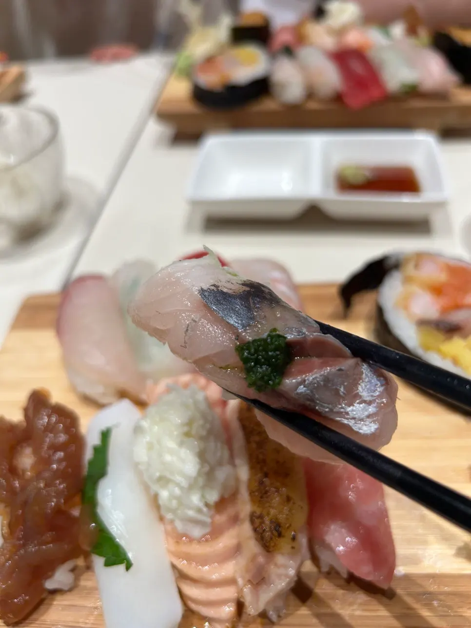 Close-up of sushi topped with thick cuts of fish