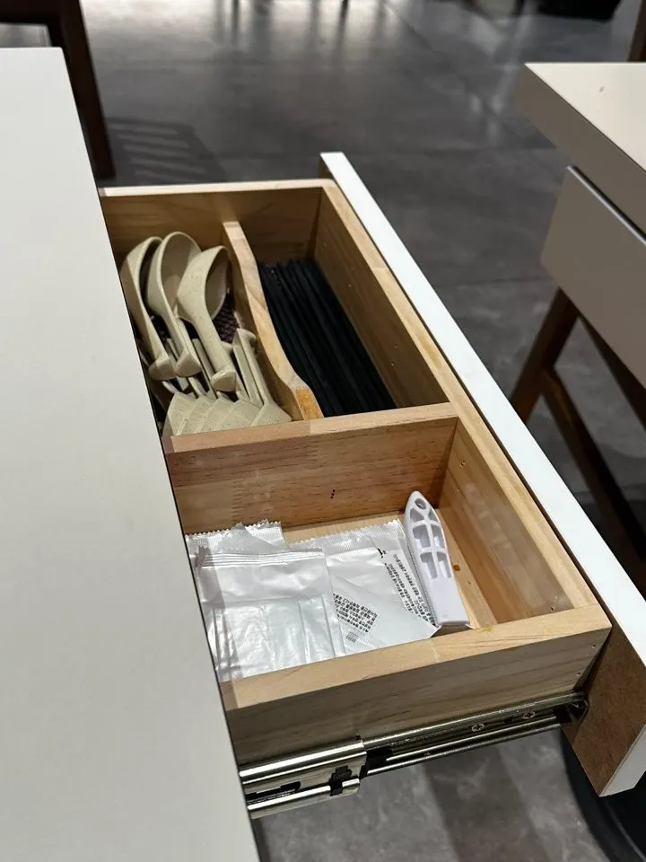 Tissues and utensils inside the drawer