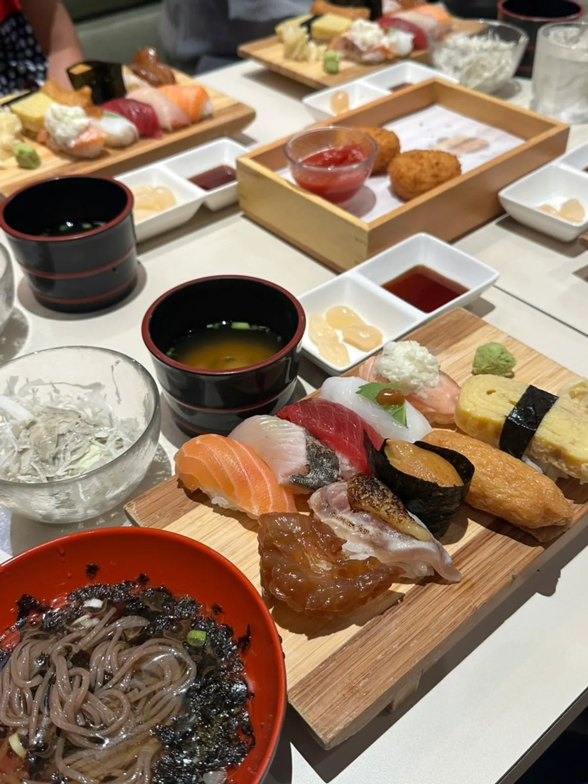 Sushi and soba laid out together on the table