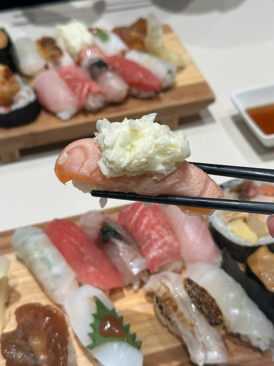 Sauce-topped swordfish sushi