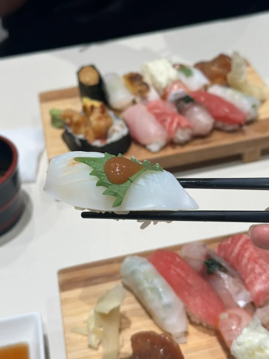 A piece of seared squid sushi