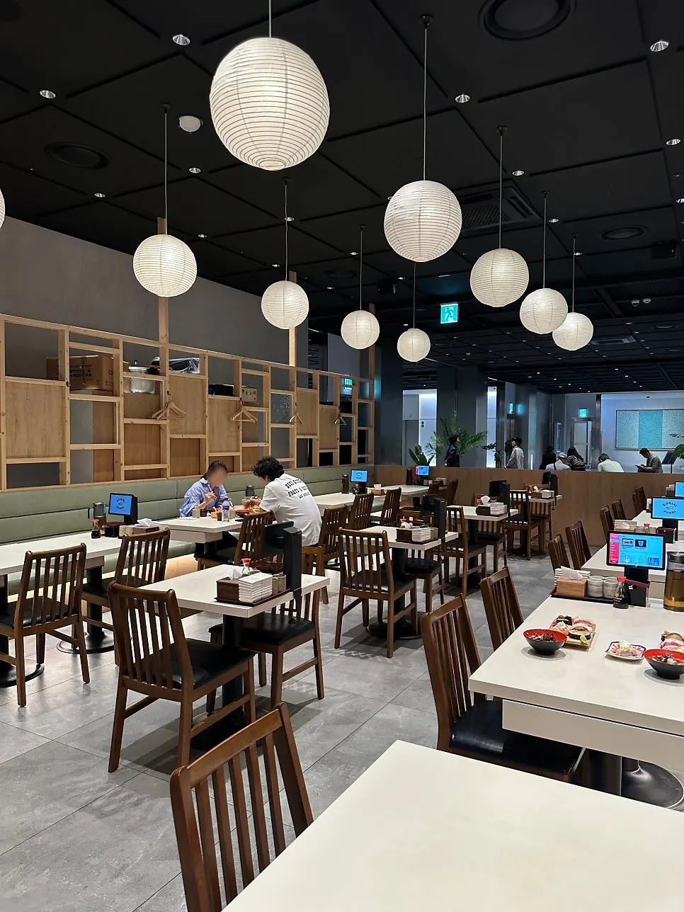 Interior with ceiling lighting and set tables