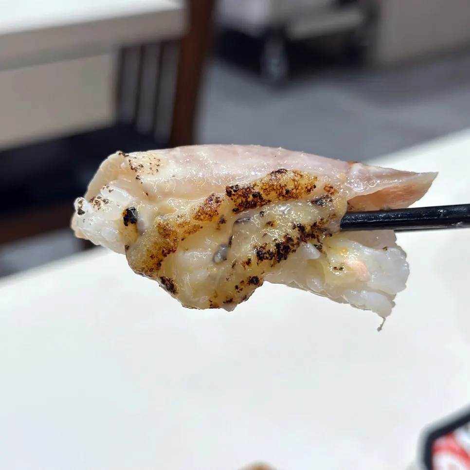 Grilled swordfish sushi topped with mayo sauce