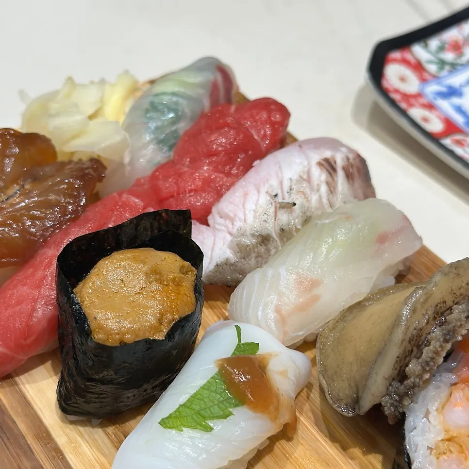 Chojanchi (seasoned squid) sushi topped with shiso