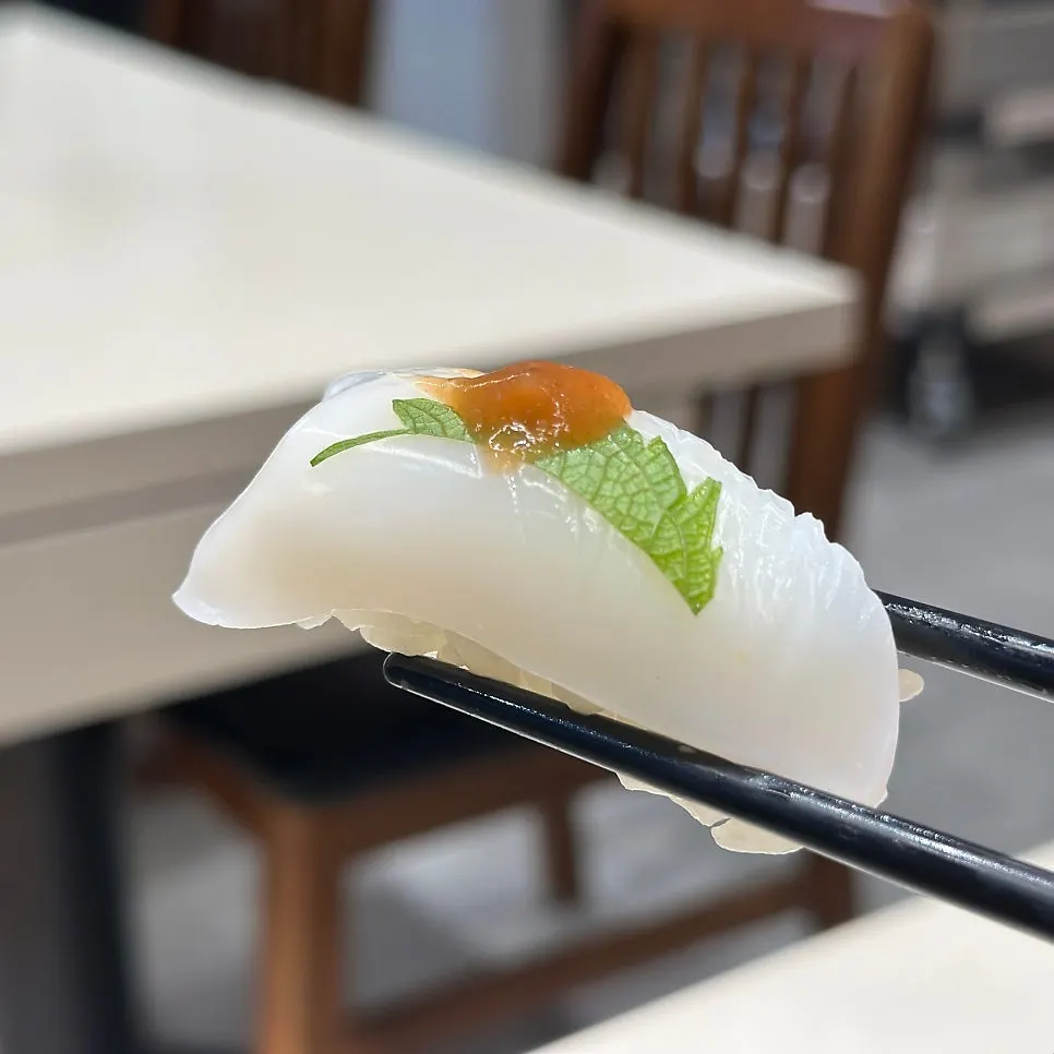 Close-up of chewy seasoned squid sushi