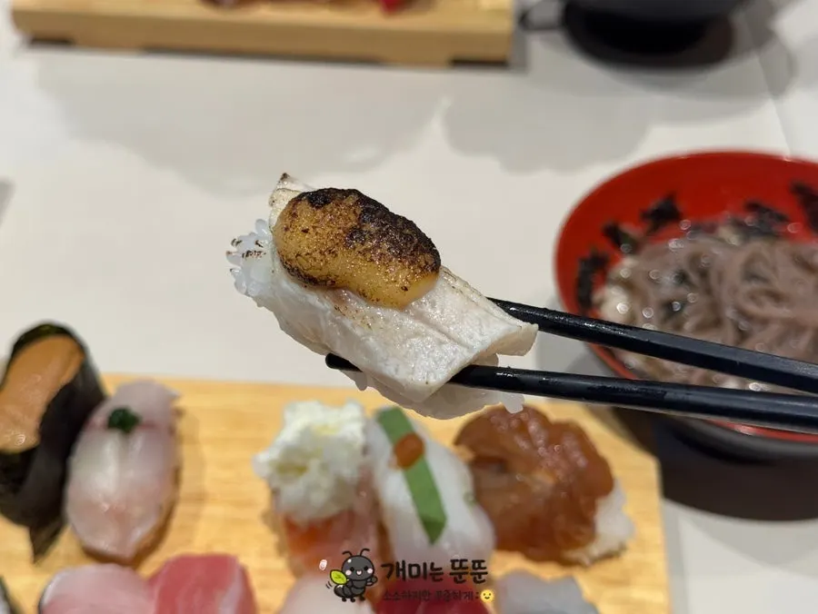 Salmon sushi topped with onion-mayo salad
