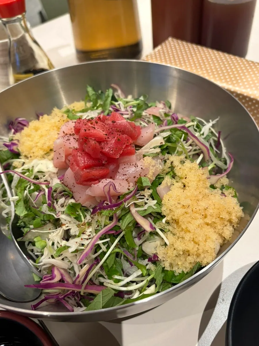 Bowl of somyeon served alongside the sushi