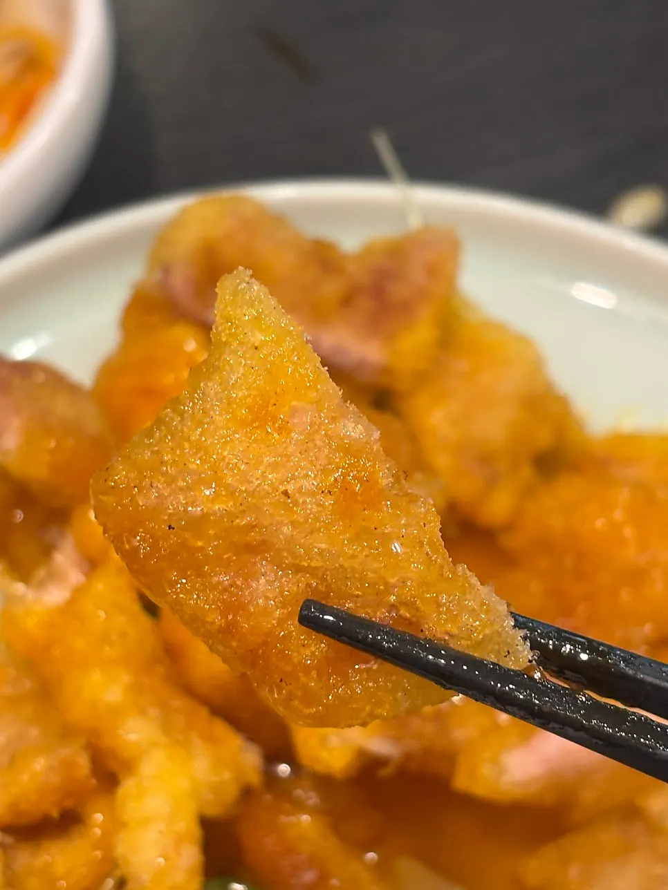 Cross-section of kkwabaerou held with chopsticks