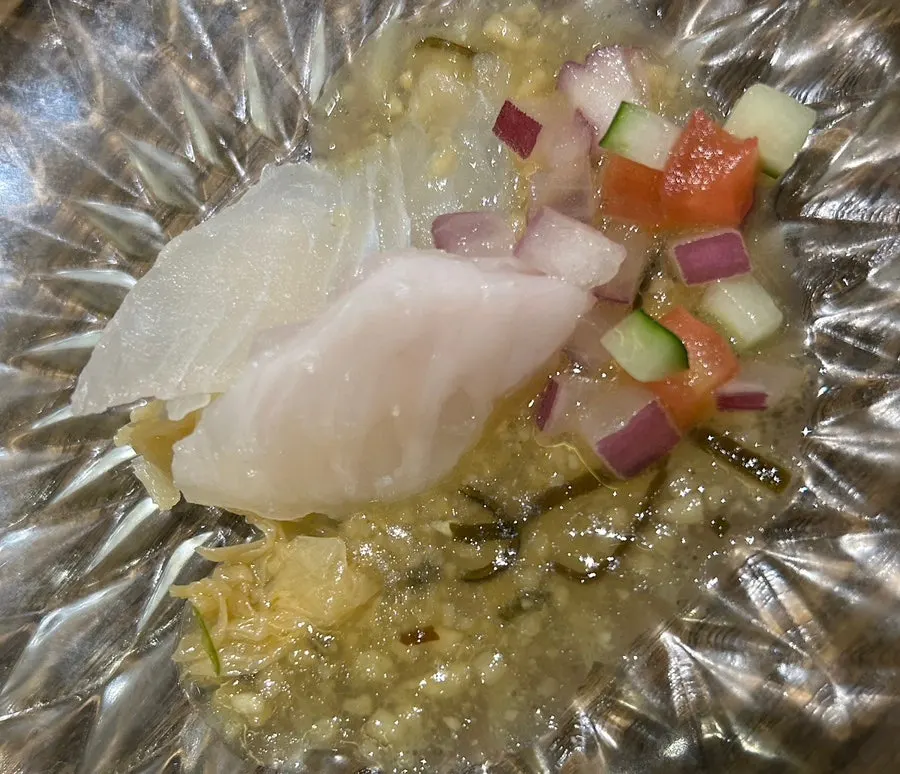 Two pieces of tangy-seasoned flounder sashimi