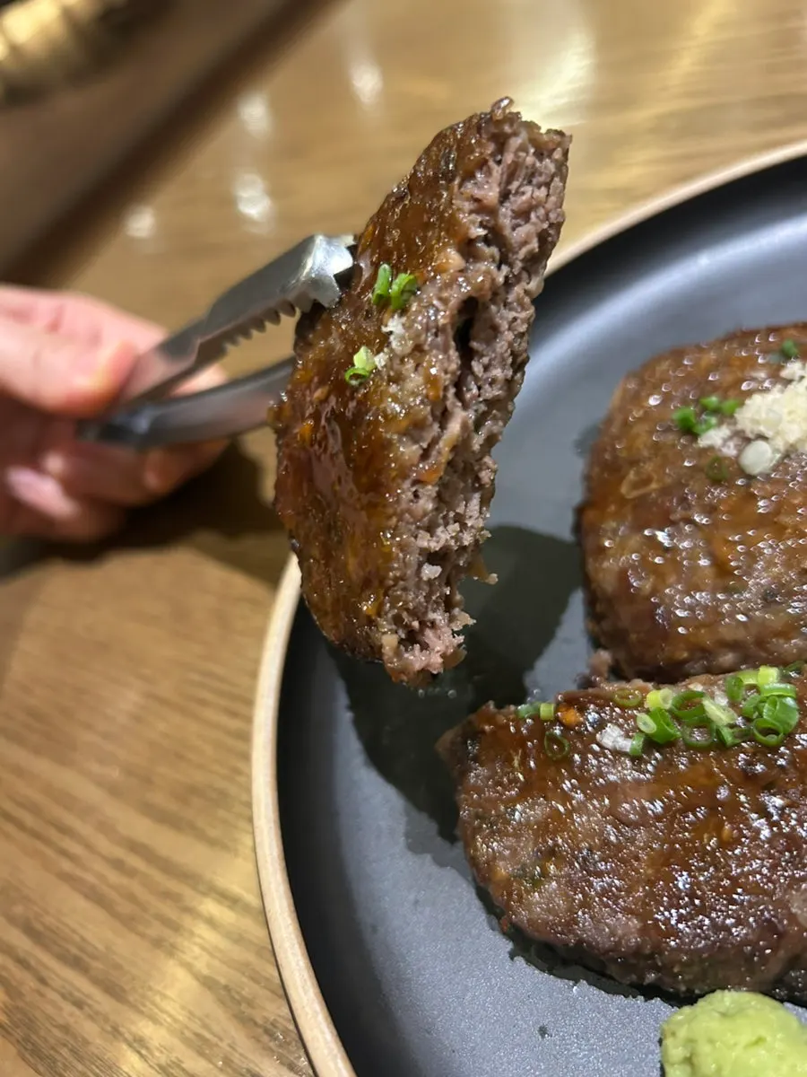 Tteokgalbi served with wasabi and vegetables