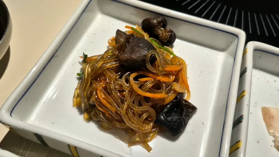 Japchae side dish served with the Pujim Set