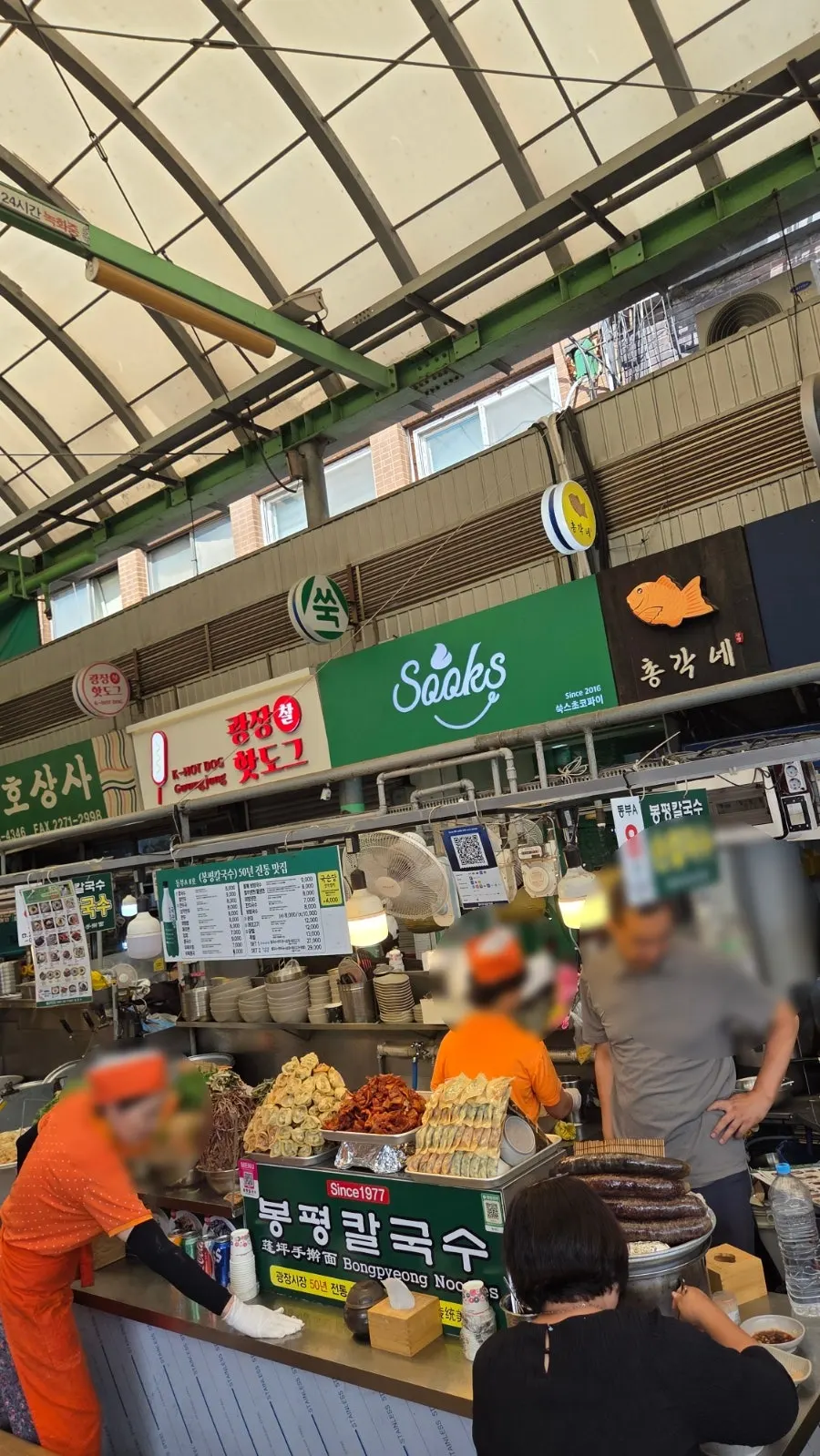 Green Ssuk's Choco Pie sign at the entrance of Gwangjang Market