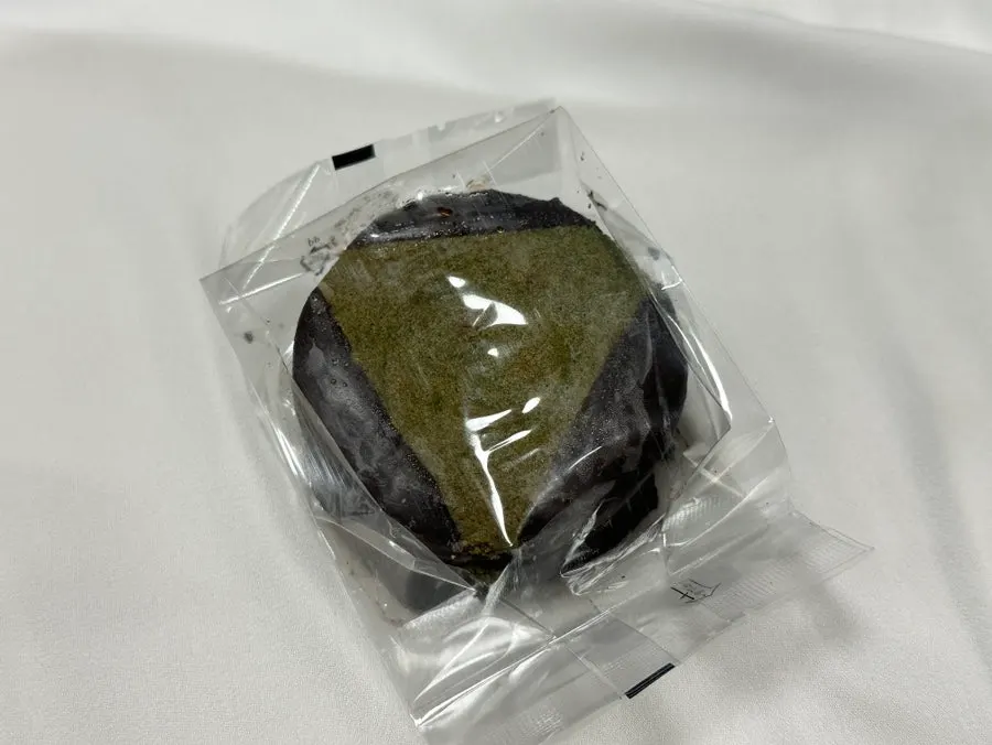 Cross-section of a mugwort choco pie cut in half, green inside