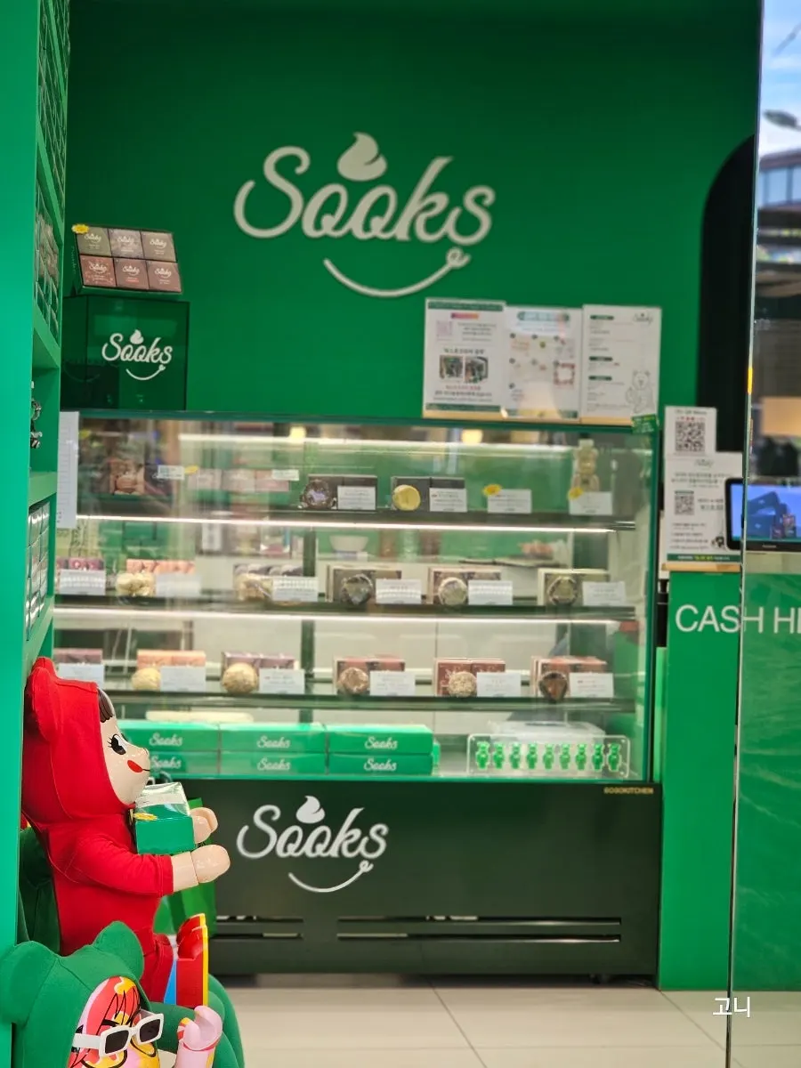 Green Bearbrick figurines displayed in the shop