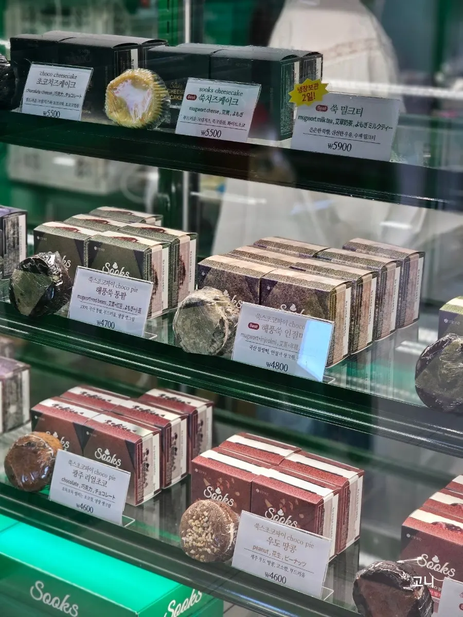 Display case with cookies and cheesecake