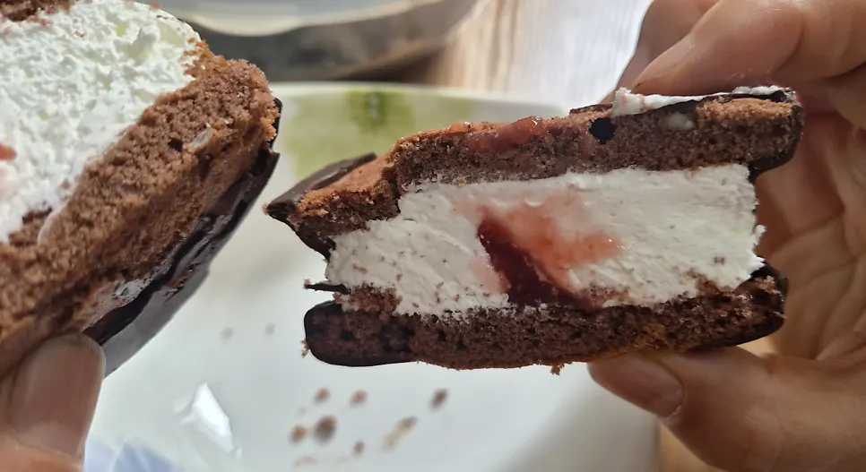 A bite taken out of the Ssuk's Choco Pie Nonsan Strawberry