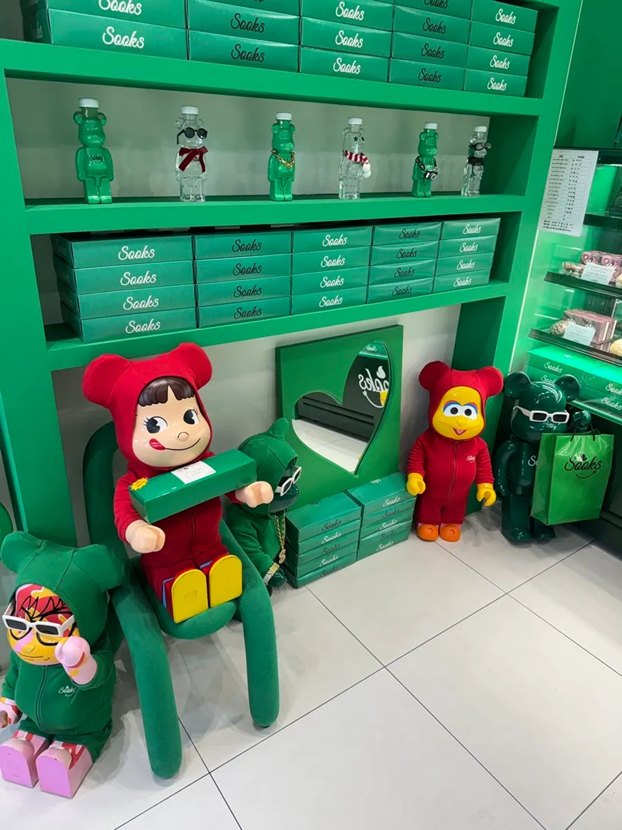Gift shopping bags and character decorations set up in the store