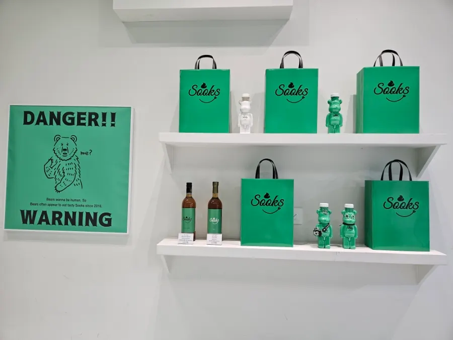 Store interior in a green, white, and black combination