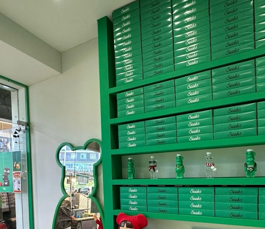 The interior waiting area of Ssuk's Choco Pie decorated with green props