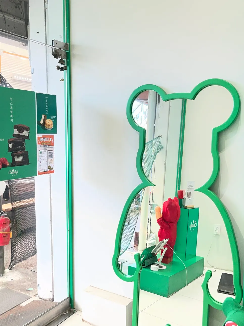 Small store interior decorated in green tones