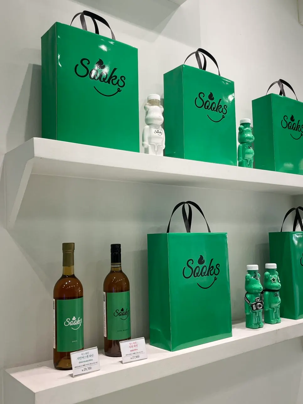 Bear-shaped green mirror on the store wall
