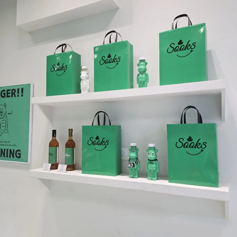 Full view of the green storefront of Ssuk's Choco Pie Seoul