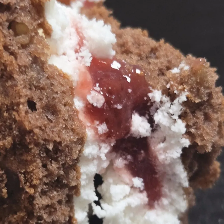 A bite of choco pie showing the fresh strawberry flavor