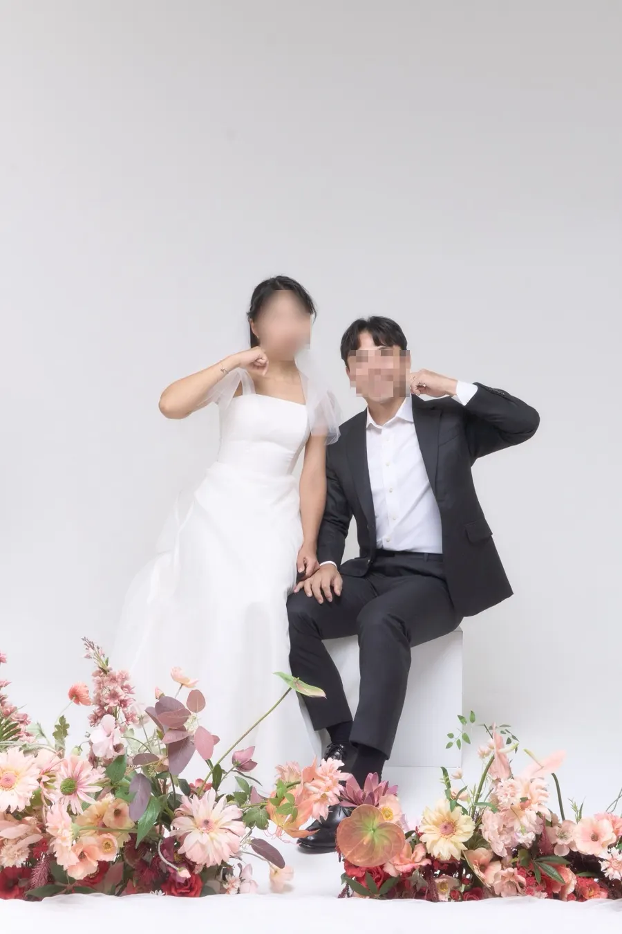 Couple photo taken against a white backdrop
