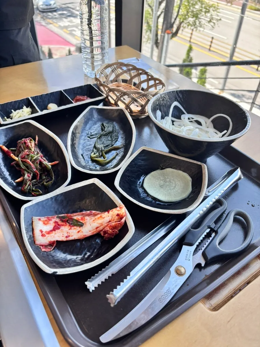 Basic table setting at Deokeun Jangeo with wild chive greens and kimchi