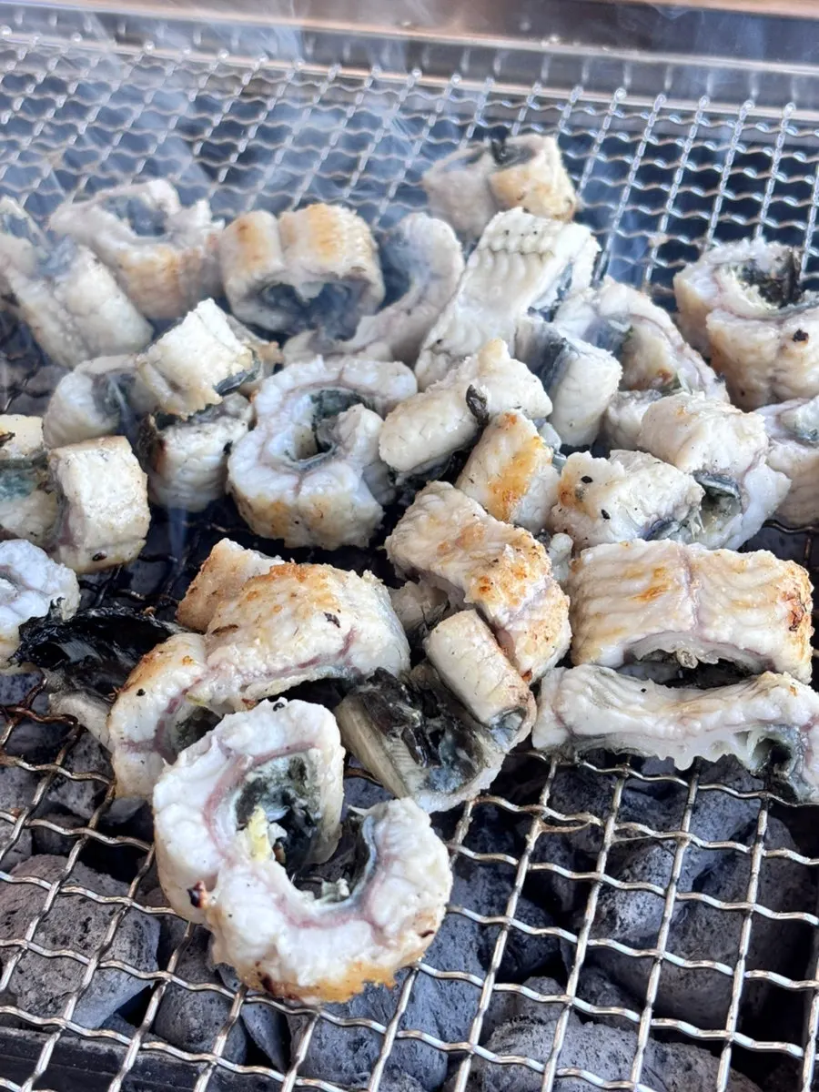 Eel cooking over the charcoal fire