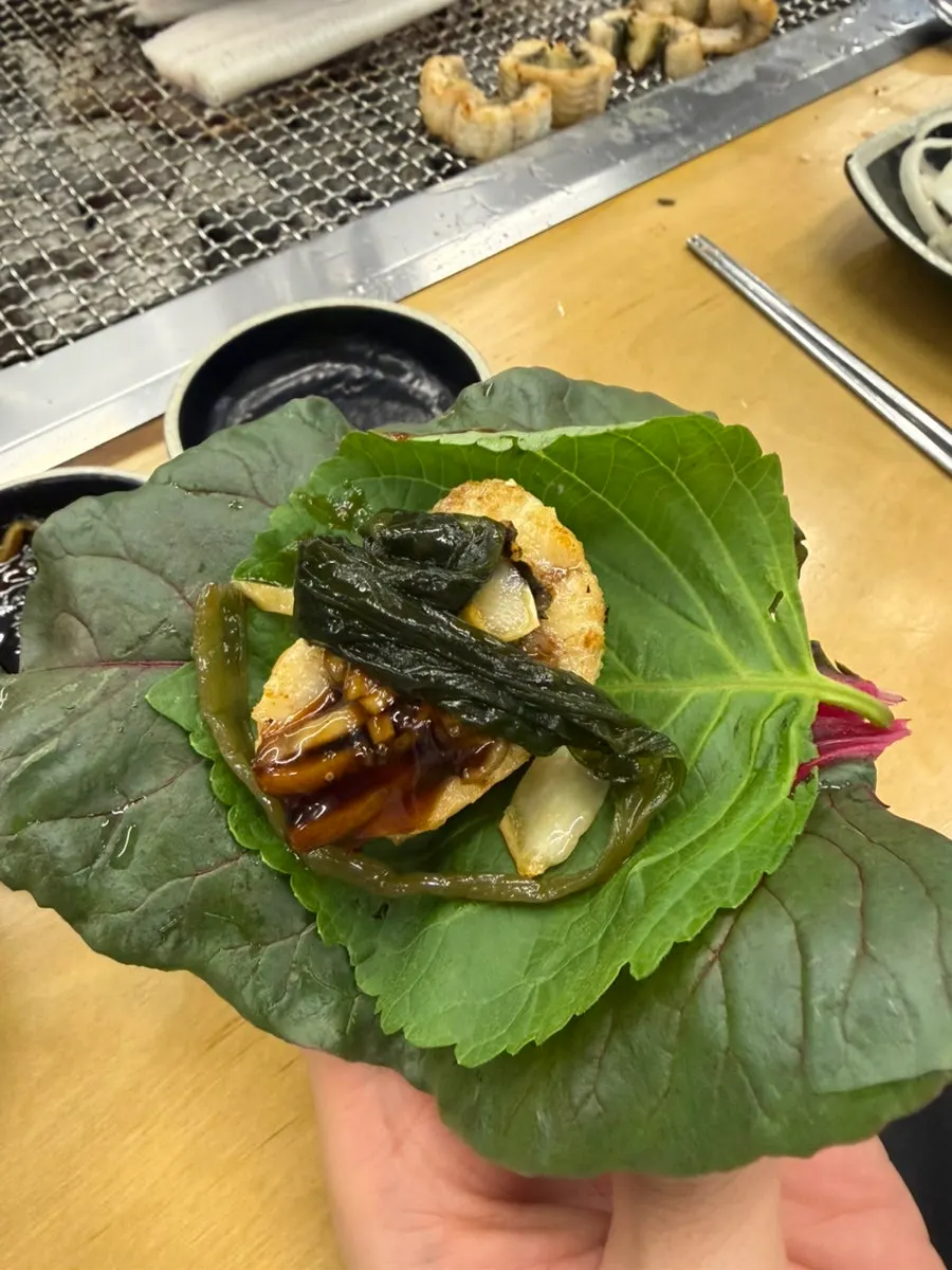 A bite of plump, fully grilled eel