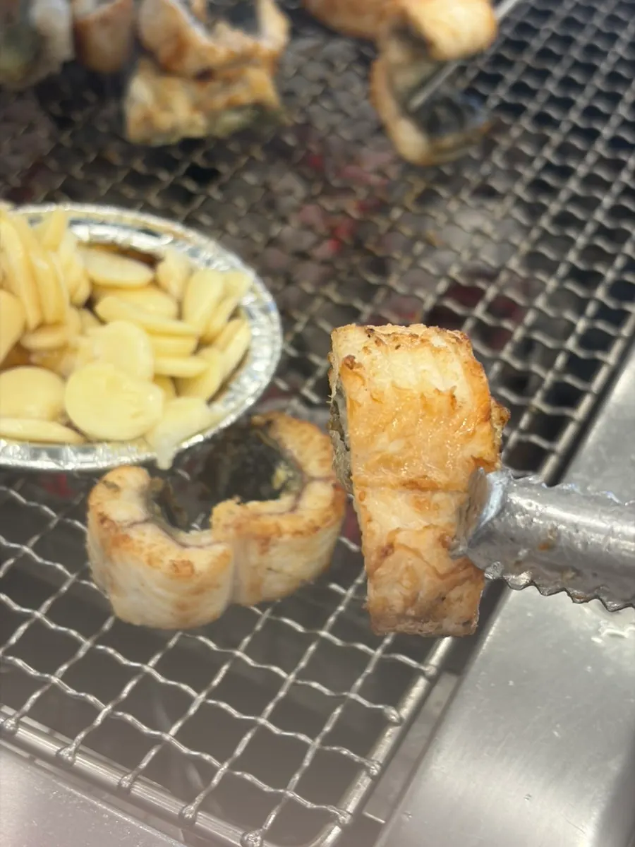 Eel grilling over the charcoal plate