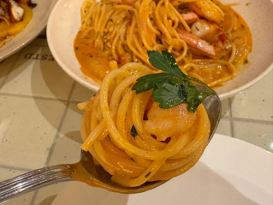 A bite of red shrimp bisque rosé pasta