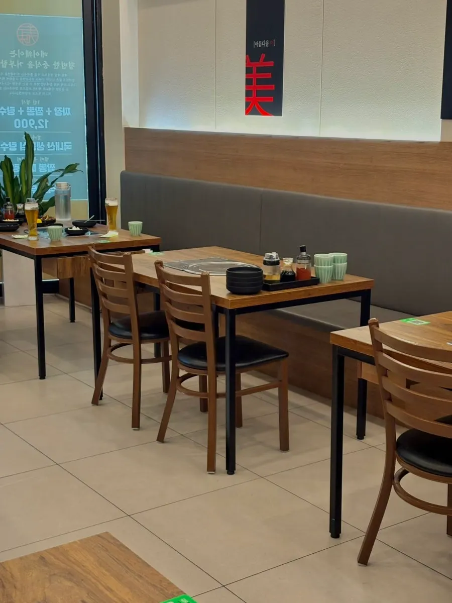 Dining hall at Mayway with two- and four-seat tables